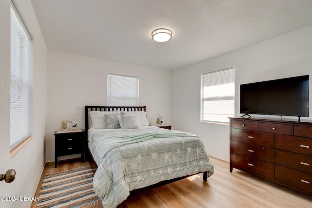 bedroom featuring light wood-type flooring