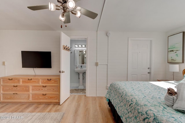 bedroom with hardwood / wood-style flooring, ceiling fan, and ensuite bathroom