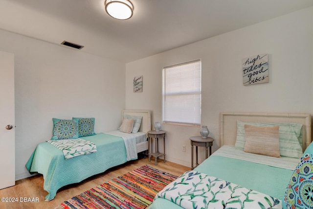 bedroom with light hardwood / wood-style floors