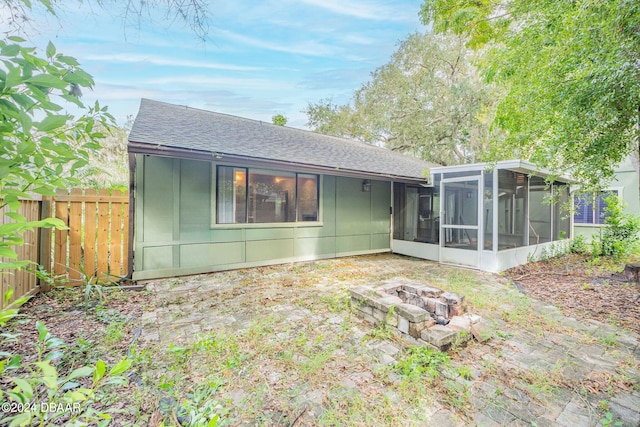 rear view of house with a sunroom