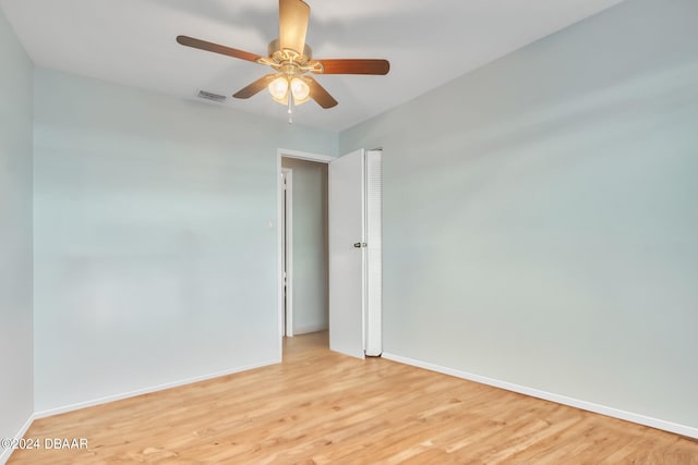 unfurnished room with ceiling fan and light hardwood / wood-style floors