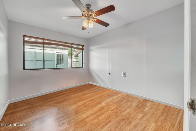 unfurnished room featuring hardwood / wood-style floors and ceiling fan