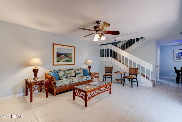 122 Cedar Dunes Dr, New Smyrna Beach, FL 32169 - living room with stairs, a ceiling fan, and baseboards