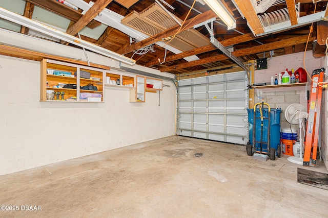 garage with concrete block wall