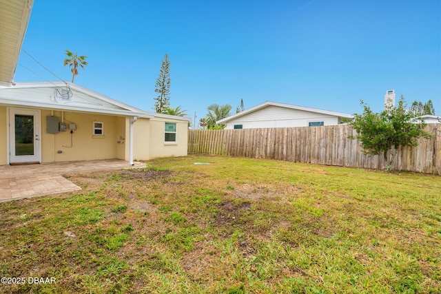 view of yard featuring a fenced backyard and a patio