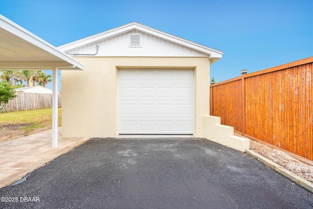 garage with fence