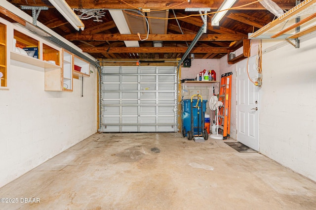 garage with concrete block wall