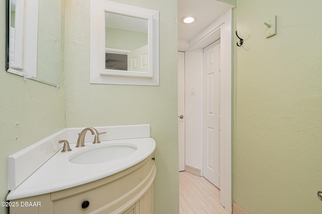 bathroom featuring vanity and wood finished floors