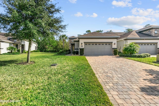 view of front of house with a garage and a front lawn