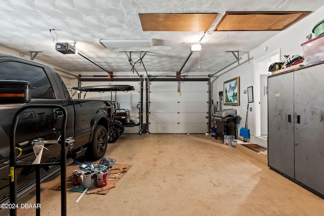 garage featuring a garage door opener