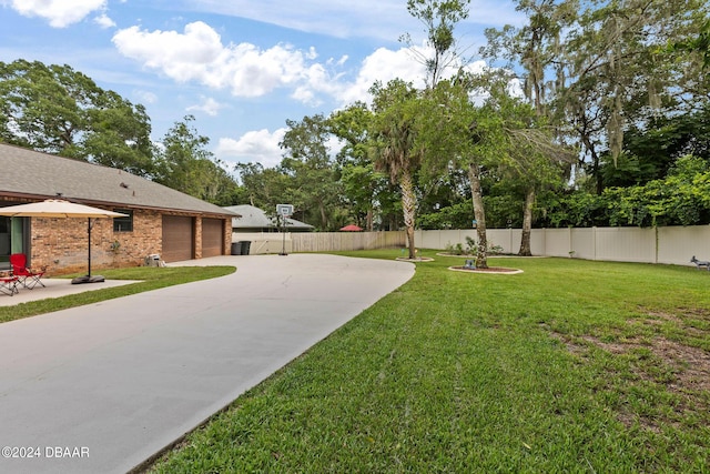 view of yard featuring a garage