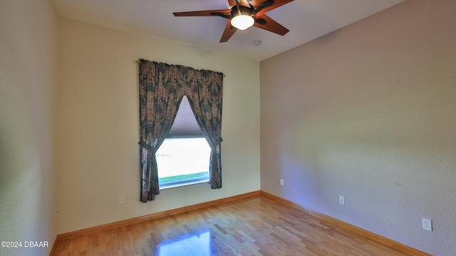 spare room with ceiling fan and light hardwood / wood-style flooring