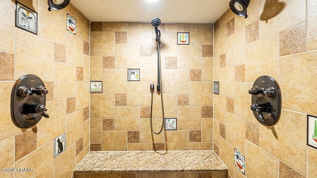 bathroom with a tile shower