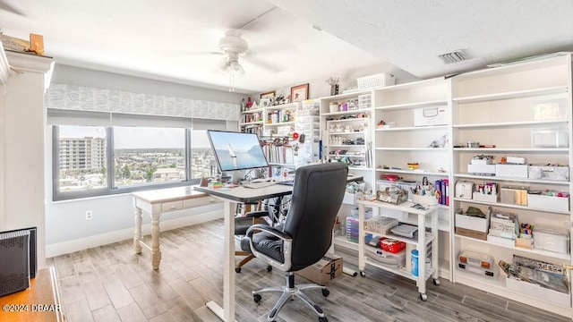 office area with ceiling fan and wood-type flooring