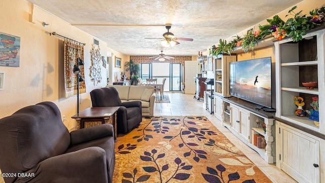 living room featuring a textured ceiling and ceiling fan