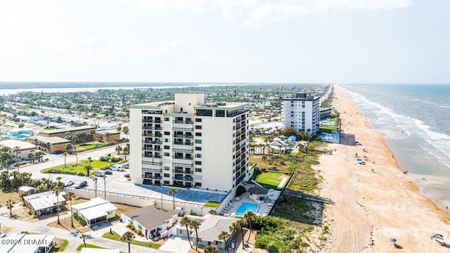 aerial view featuring a view of the beach and a water view