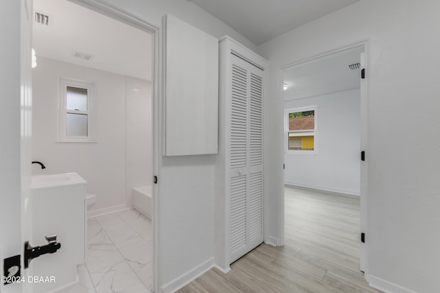 bathroom featuring vanity, hardwood / wood-style flooring, and toilet