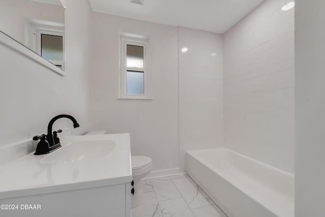 full bathroom featuring vanity, toilet, and tiled shower / bath