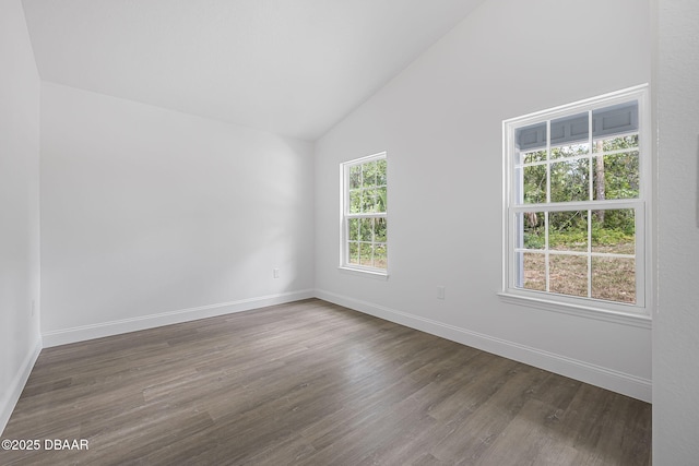 5620 Ridgewood Ave, Deleon Springs, FL 32130 - empty room with baseboards, dark wood-style floors, and high vaulted ceiling