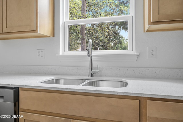 5620 Ridgewood Ave, Deleon Springs, FL 32130 - kitchen with light stone countertops, a sink, and dishwasher