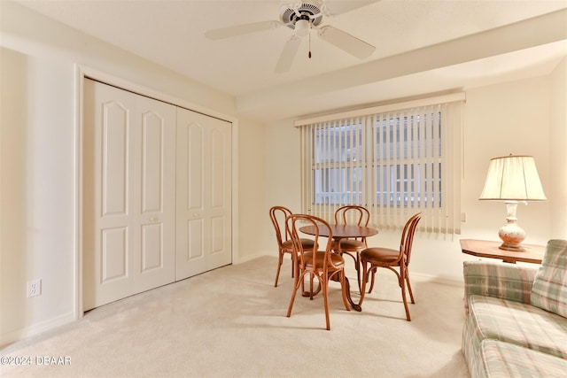 dining area with carpet floors, baseboards, and a ceiling fan