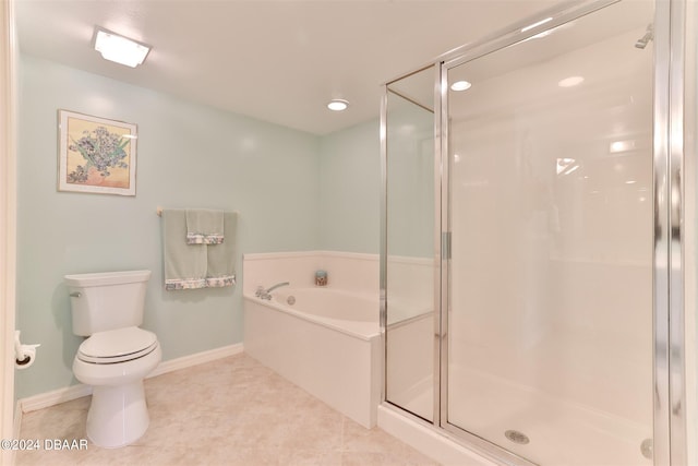 bathroom with a stall shower, tile patterned flooring, a garden tub, and toilet