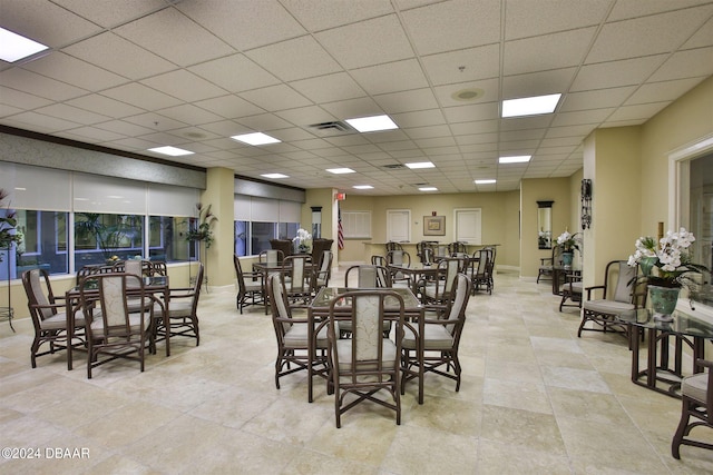 dining space with a drop ceiling and visible vents