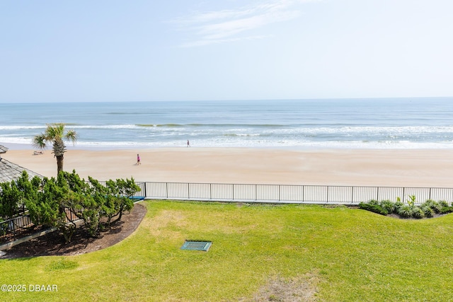 water view featuring fence and nearby beach