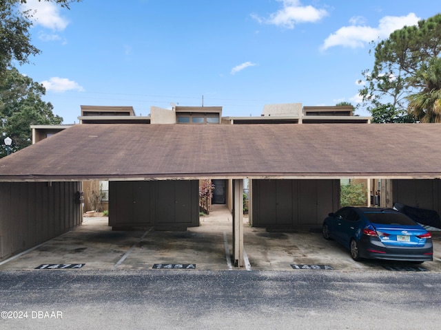 view of front of home with a carport