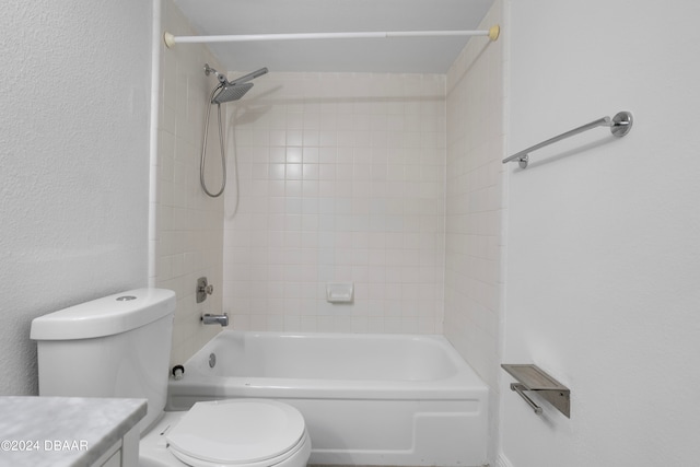 full bathroom featuring vanity, toilet, and tiled shower / bath combo