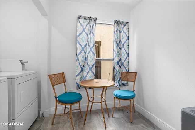 living area with washer and clothes dryer