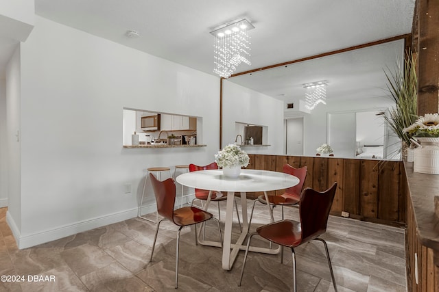 dining space featuring a textured ceiling