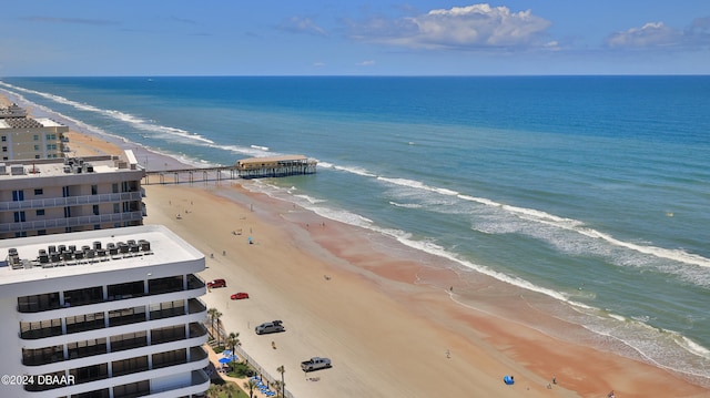 drone / aerial view featuring a view of the beach and a water view