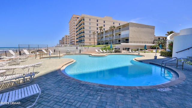 view of swimming pool with a patio