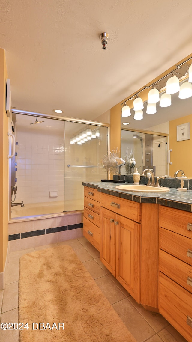 bathroom with tile patterned flooring and vanity