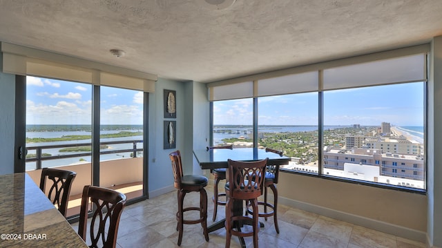 dining room featuring a water view