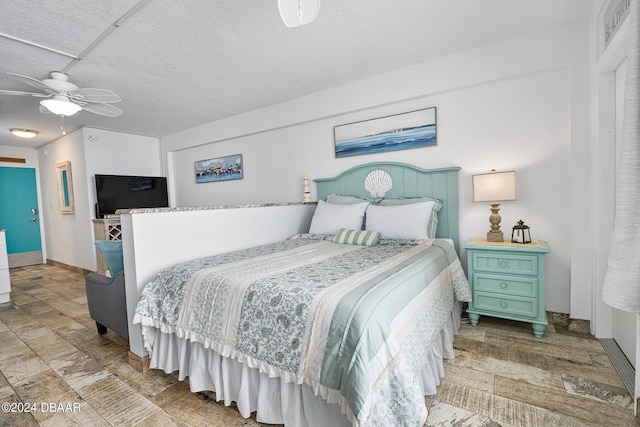 800 N Atlantic Ave Unit 523, Daytona Beach, FL 32118 - bedroom with a ceiling fan and baseboards