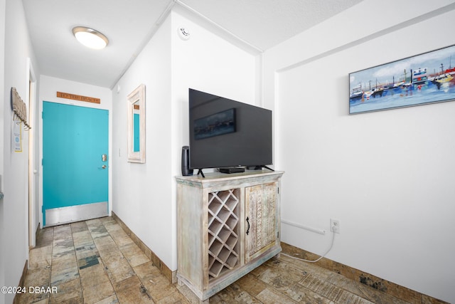 800 N Atlantic Ave Unit 523, Daytona Beach, FL 32118 - corridor with stone finish flooring and baseboards
