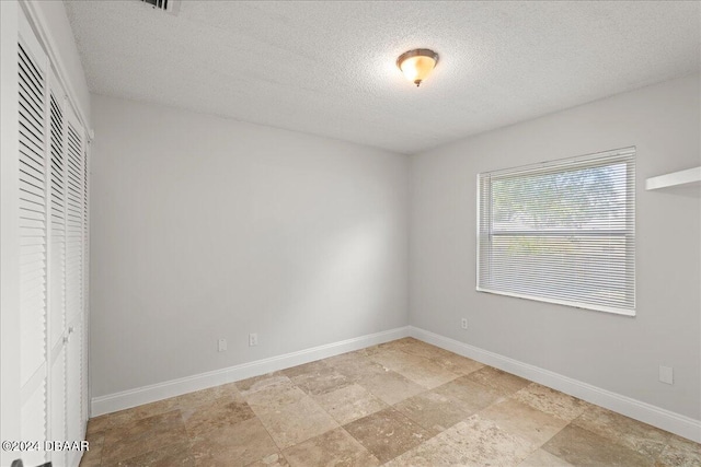 interior space featuring a textured ceiling