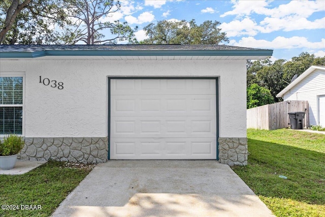 garage with a lawn