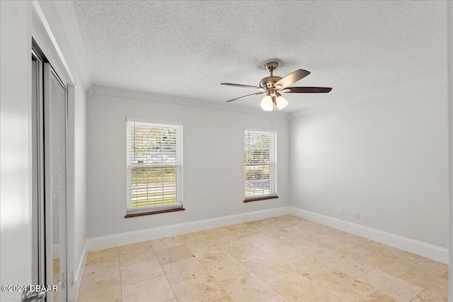 spare room featuring crown molding, a textured ceiling, and ceiling fan