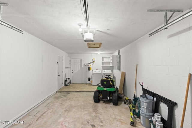 garage featuring a garage door opener, water heater, and washer and clothes dryer