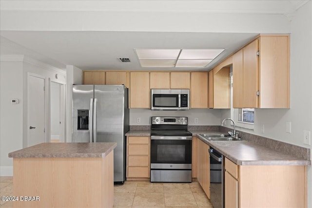 kitchen featuring stainless steel appliances, sink, light brown cabinets, light tile patterned floors, and a kitchen island