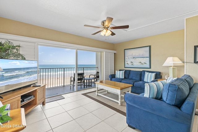 815 Ocean Shore Blvd Unit U1B, Ormond Beach, FL 32176 - living room featuring a ceiling fan, light tile patterned floors, and a water view
