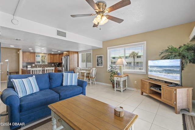 815 Ocean Shore Blvd Unit U1B, Ormond Beach, FL 32176 - living room featuring baseboards, light tile patterned flooring, ceiling fan, healthy amount of natural light, and recessed lighting