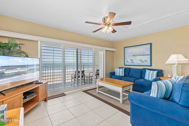 tiled living room featuring ceiling fan