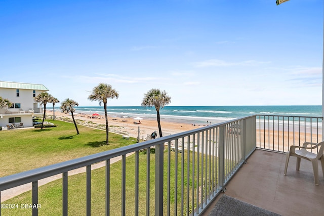 balcony with a view of the beach and a water view