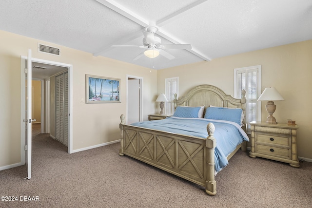 815 Ocean Shore Blvd Unit U1B, Ormond Beach, FL 32176 - bedroom with light carpet, beamed ceiling, baseboards, and ceiling fan