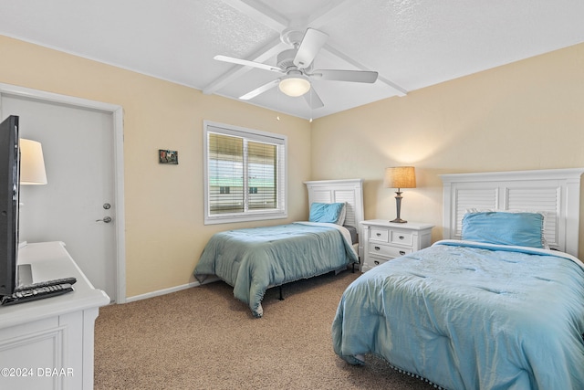 carpeted bedroom featuring a textured ceiling and ceiling fan