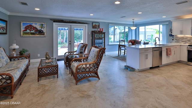 interior space featuring visible vents, baseboards, ornamental molding, and french doors